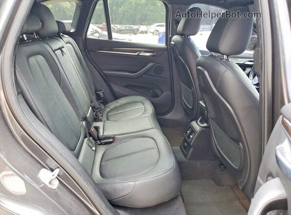 WBXHT3C36G5E48134 2016 BMW X1 Gray Rear interior view