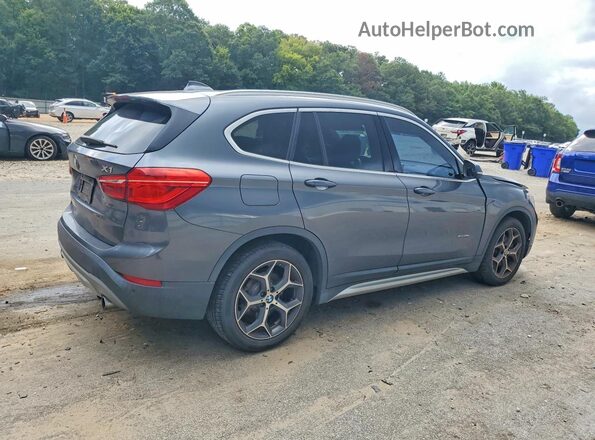 WBXHT3C36G5E48134 2016 BMW X1 Gray Rear right