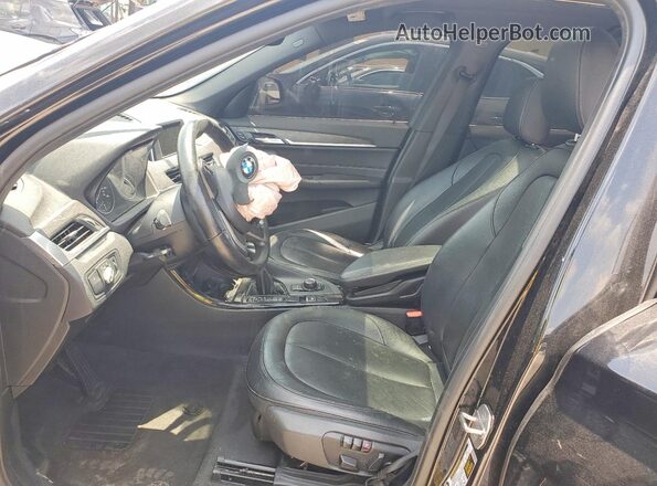 WBXHT3C36G5F66183 2016 BMW X1 Black Vista interior delantera