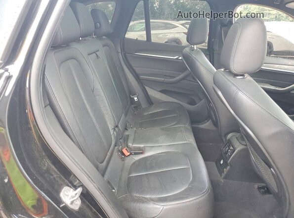 WBXHT3C36G5F66183 2016 BMW X1 Black Vista interior trasera