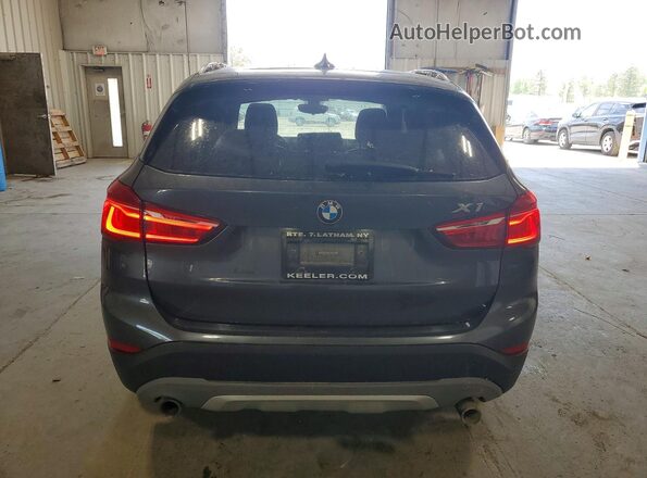 WBXHT3C36H5F68386 2017 BMW X1 Gray Vista trasera