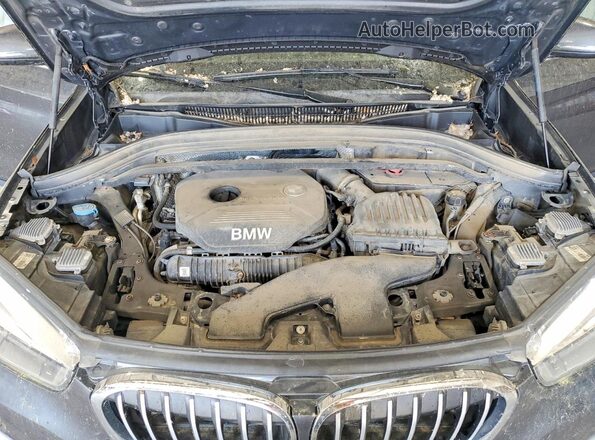 WBXHT3C36H5F68386 2017 BMW X1 Gray Vista interior trasera