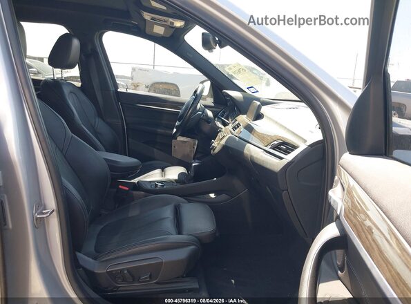 WBXHT3C36J5K24382 2018 BMW X1 Silver Front interior view