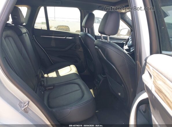 WBXHT3C36J5K24382 2018 BMW X1 Silver VIN sticker view