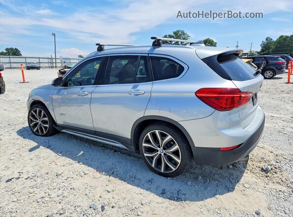 WBXHT3C37H5F71202 2017 BMW X1 Silver Trasero izquierdo