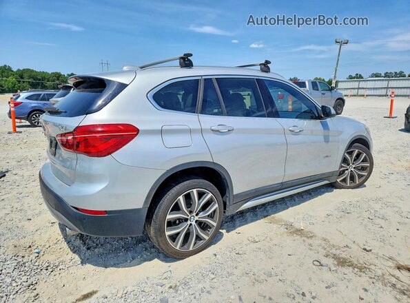 WBXHT3C37H5F71202 2017 BMW X1 Silver Trasero derecho