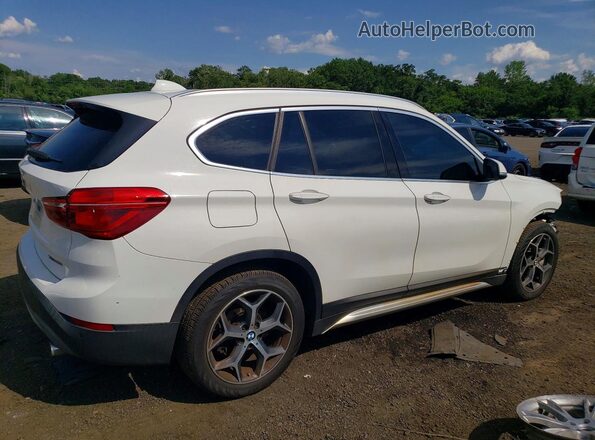 WBXHT3C37J5L30999 2018 BMW X1 White Rear right