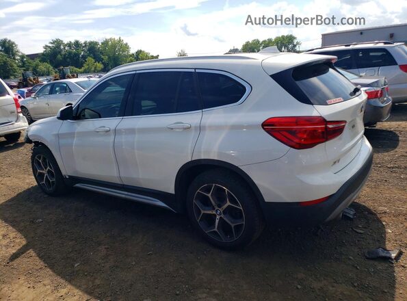 WBXHT3C37J5L30999 2018 BMW X1 White Rear left