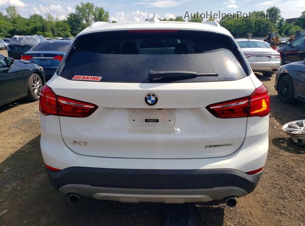 WBXHT3C37J5L30999 2018 BMW X1 White Rear view