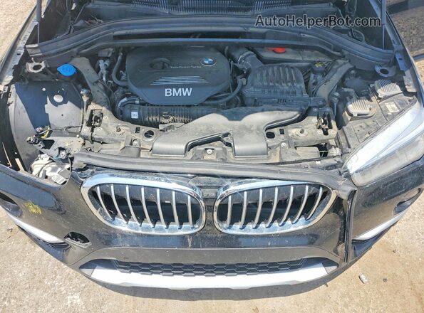 WBXHT3C38H5F77414 2017 BMW X1 Black Rear interior view
