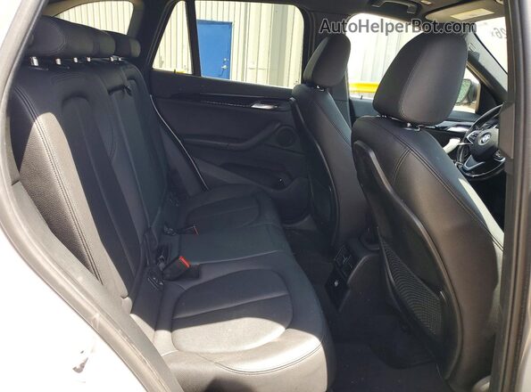 WBXHT3C38J5F93201 2018 BMW X1 Silver Rear interior view
