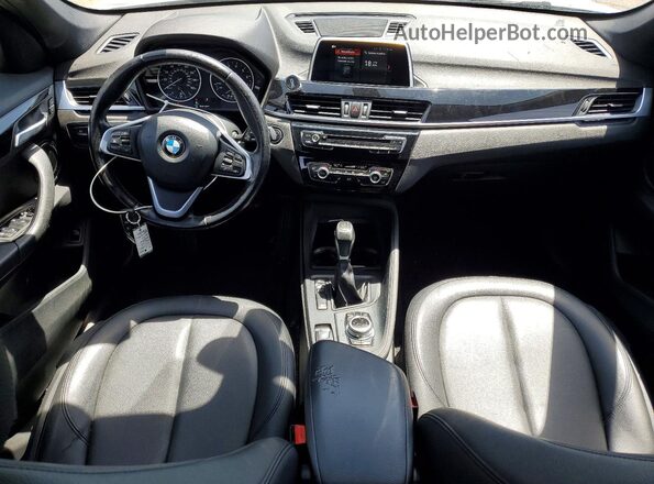 WBXHT3C38J5F93201 2018 BMW X1 Silver Dashboard view