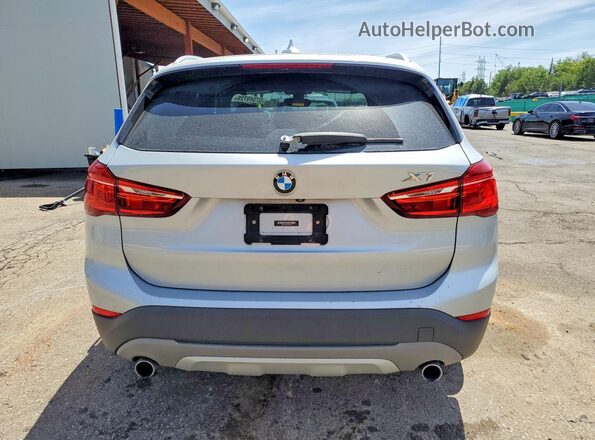 WBXHT3C38J5F93201 2018 BMW X1 Silver Rear view