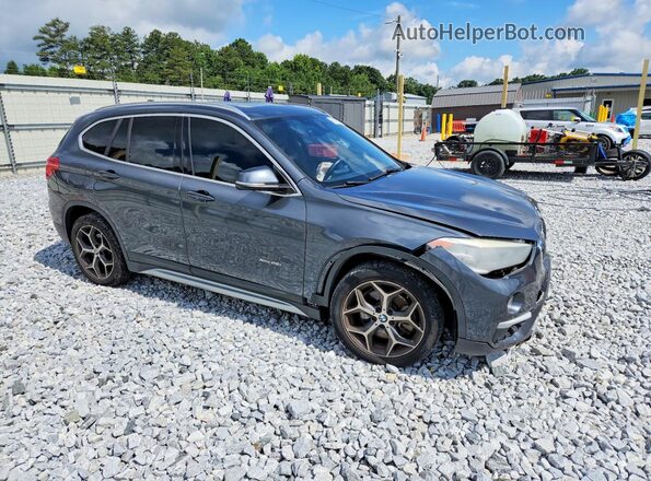 WBXHT3C39G5F63794 2016 BMW X1 Gray Front right