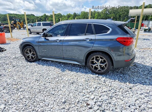 WBXHT3C39G5F63794 2016 BMW X1 Gray Rear left