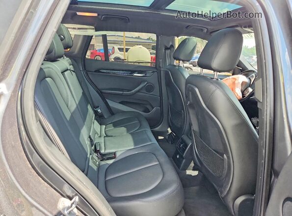 WBXHT3C39G5F63794 2016 BMW X1 Gray Rear interior view