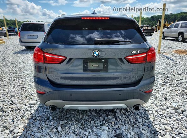 WBXHT3C39G5F63794 2016 BMW X1 Gray Rear view