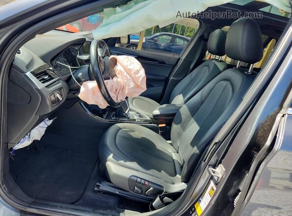 WBXHT3C39G5F63794 2016 BMW X1 Gray Front interior view