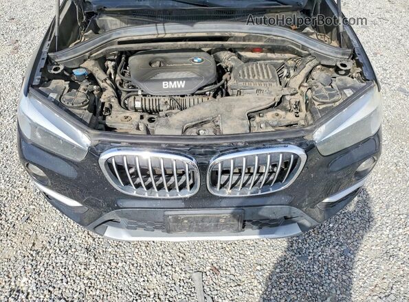 WBXHT3C3XJ5L24548 2018 BMW X1 Black Vista interior trasera
