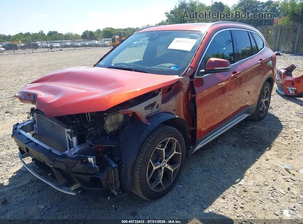 WBXHT3C53K5L89647 2019 BMW X1 Orange Vista tres cuartos delantera izquierda