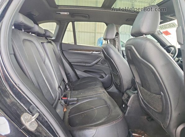 WBXHT3Z34H4A55165 2017 BMW X1 Black Rear interior view
