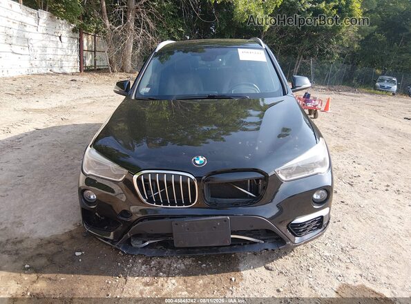 WBXHT3Z34H4A64951 2017 BMW X1 Black Rear interior view
