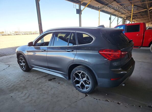 WBXHT3Z36H4A65129 2017 BMW X1 Gray Trasero izquierdo