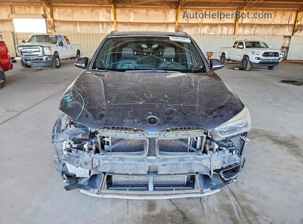 WBXHT3Z36H4A65129 2017 BMW X1 Gray Vista frontal