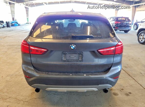 WBXHT3Z39H4A65397 2017 BMW X1 Gray Вид ззаду