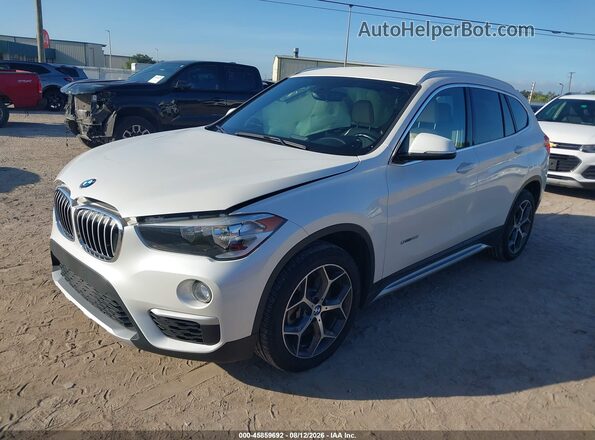 WBXHU7C33J5H39783 2018 BMW X1 White Vista tres cuartos delantera izquierda
