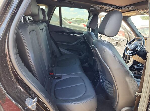 WBXHU7C35H5H34790 2017 BMW X1 Black Rear interior view