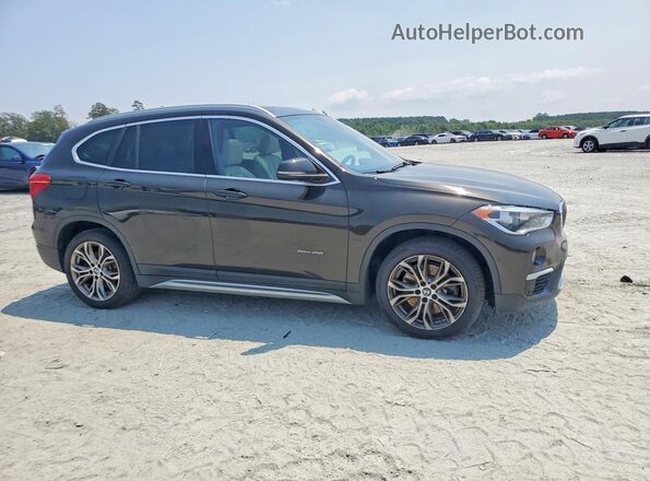 WBXHU7C35H5H37334 2017 BMW X1 Black Передня права чверть