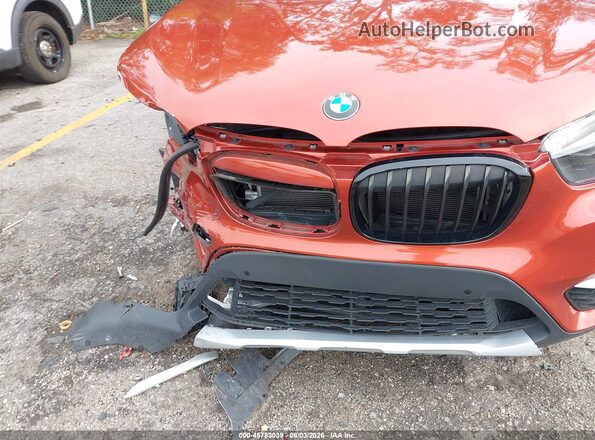 WBXHU7C35J3F04247 2018 BMW X1 Orange Դիմացի տեսք