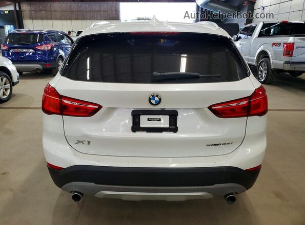 WBXHU7C37J5L09073 2018 BMW X1 White Rear view