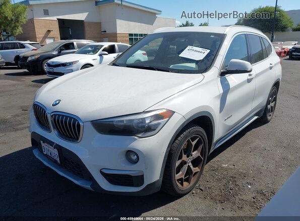 WBXHU7C38H5H35769 2017 BMW X1 White Front left
