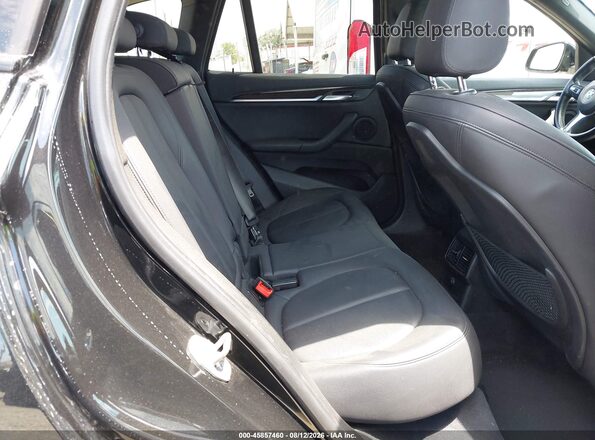 WBXHU7C39J5L05770 2018 BMW X1 Black Вид наклейки з VIN-кодом