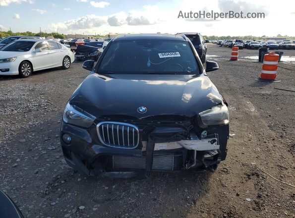 WBXHU7C52K5L10618 2019 BMW X1 Black Vista trasera