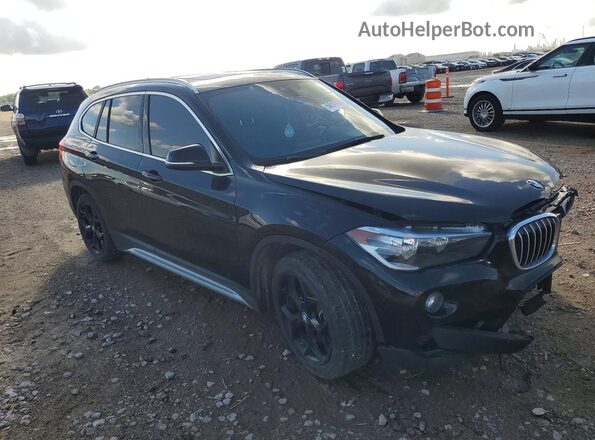 WBXHU7C52K5L10618 2019 BMW X1 Black Vista frontal