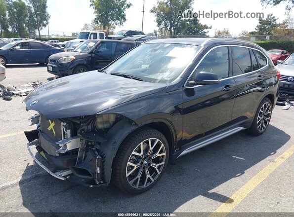 WBXJG7C03M5T30652 2021 BMW X1 Black Front left