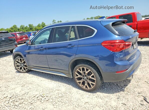 WBXJG7C06M5U25982 2021 BMW X1 Blue Trasero izquierdo
