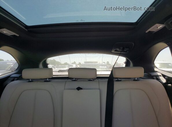 WBXJG7C06M5U25982 2021 BMW X1 Blue Vista de los asientos traseros