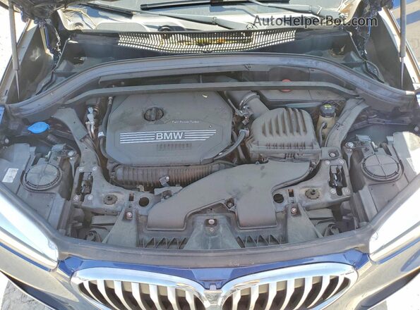 WBXJG7C06M5U25982 2021 BMW X1 Blue Vista del compartimento del motor