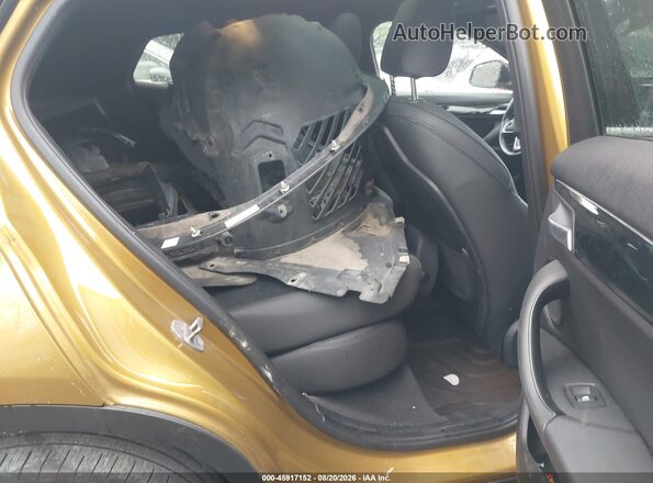 WBXYJ1C03L5P48799 2020 BMW X2 Gold Вид наклейки з VIN-кодом