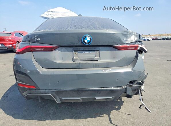 WBY23HD09SFT98932 2025 BMW I4 Gray Rear view