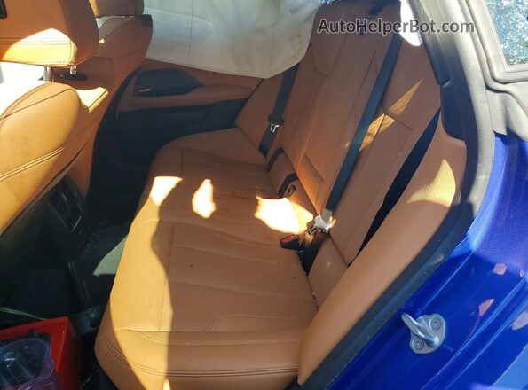 WBY33HD04SFV48692 2025 BMW I4 Blue Vista de los asientos traseros