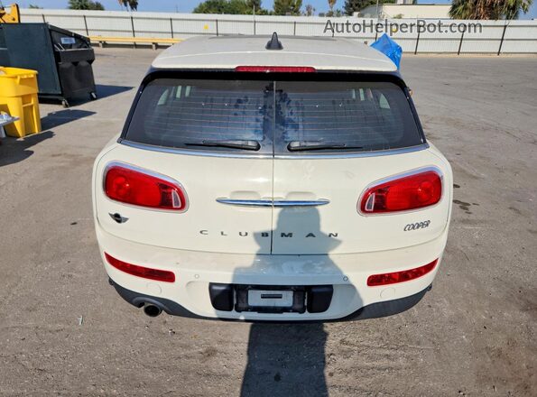 WMWLN5C55H2E32909 2017 MINI COOPER Cream Rear view