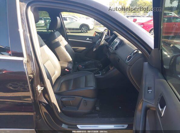 WVGAV7AX6GW519227 2016 VOLKSWAGEN TIGUAN Black Front interior view