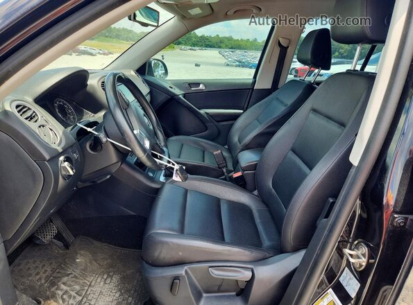 WVGAV7AX6GW599113 2016 VOLKSWAGEN TIGUAN Black წინა სალონის ხედი