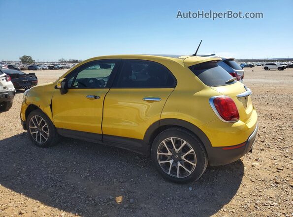 ZFBCFYET0GP334591 2016 FIAT 500X Yellow Trasero izquierdo