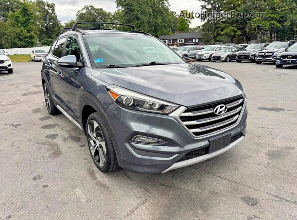 KM8J3CA24HU554624 2017 HYUNDAI TUCSON Black Front view